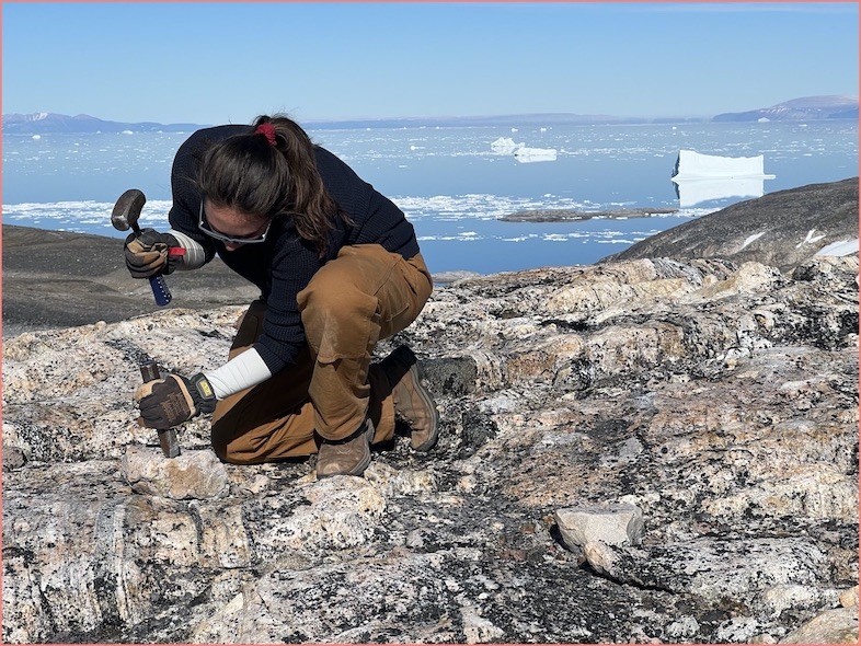Karlee Prince, Graduate Student, collects a rock sample from NW Greenland cosmogenic sampling. Karlee Prince collecting a rock sample