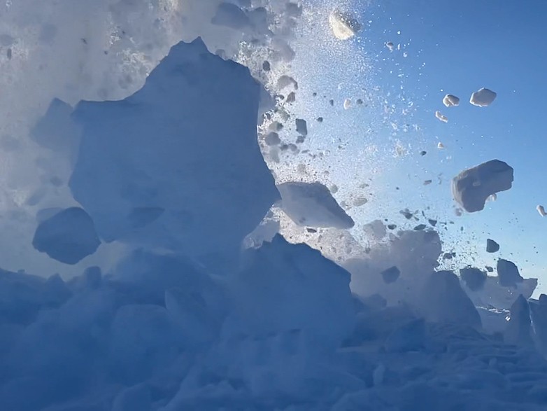 Ice is shot into the air as the small explosion is set off. Explosion