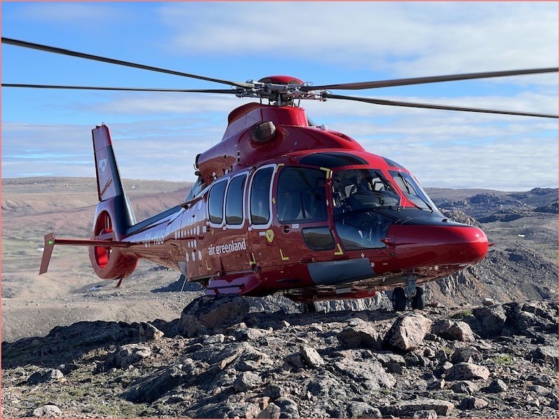 Rock samples were collected by helicopter in areas of NW Greenland. Air Greenland Helicopter Doing A Sample Collection Stop