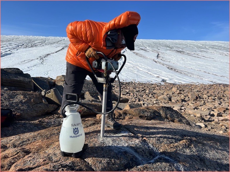 Project lead PI Joerg Shaefer dilling rock core sample in NW Greeland PI Joerg Shaefer dilling rock core